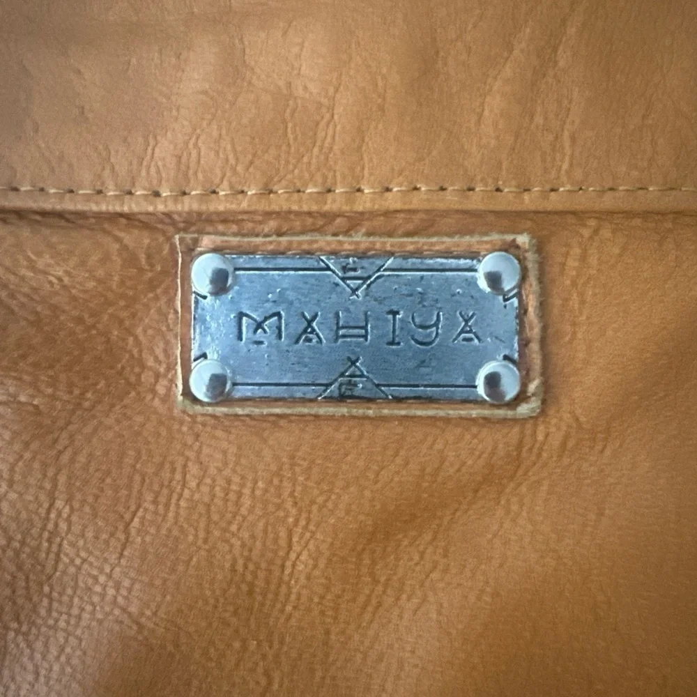 Mahiya Leather Tan Fringe Shoulder Bag with Floral Hand Tooling and Stone Inlay